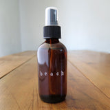 Amber glass bottle of Beach Oil :: Santo Cabo